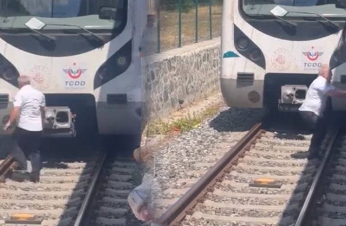 Kediyi kurtarmak için treni durdurdu, raylara indi